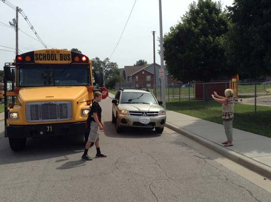 Supplied Photo: Student crossing street in front of school bus.