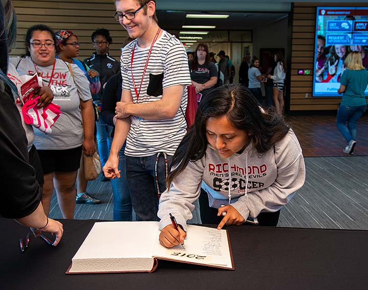 Supplied Photo: Freshman students sign the class book during the First Year Convocation held August 17. The ceremony is the kickoff to new student's academic experience at IU East.