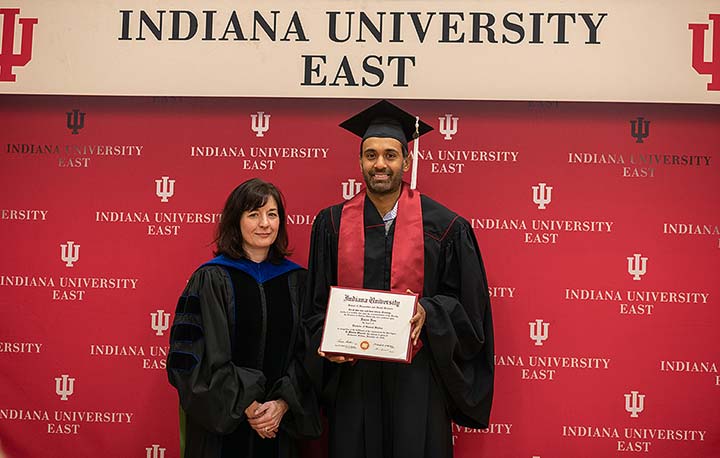 Supplied Photo: Michelle Malott, executive vice chancellor for Academic Affairs, presents Rajeev Ram with his Bachelor of General Studies degree. 