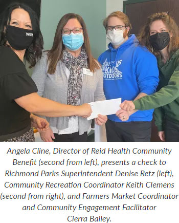 Supplied Photo: Angela Cline, Director of Reid Health Community Benefit (second from left), presents a check to Richmond Parks Superintendent Denise Retz (left), Community Recreation Coordinator Keith Clemens (second from right), and Farmers Market Coordinator