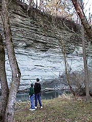 Photo: Boys look at limestone cliff