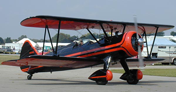 Biplane - orange and black.