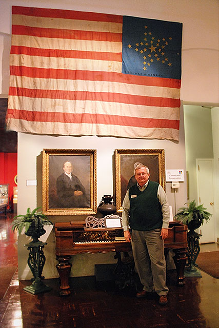 Museum Director, Jim Harlan, with the Lincoln-Hamlin Banner